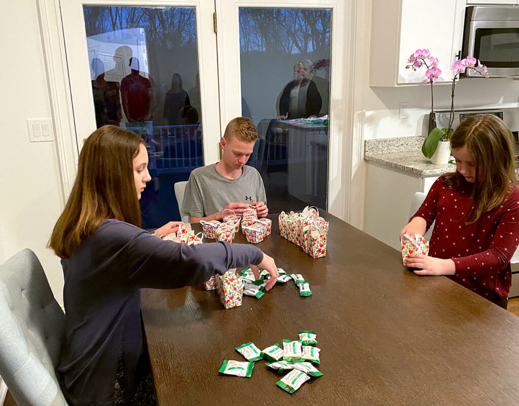 Marcel’s grandchildren creating Easter goodie baskets for a local nursing home.